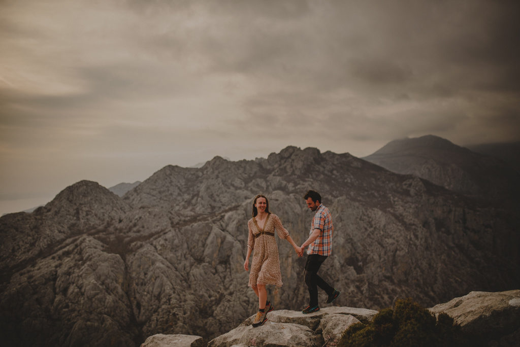 Woman Walking in the Middle of the Road at the Foot of the Mountain · Free  Stock Photo